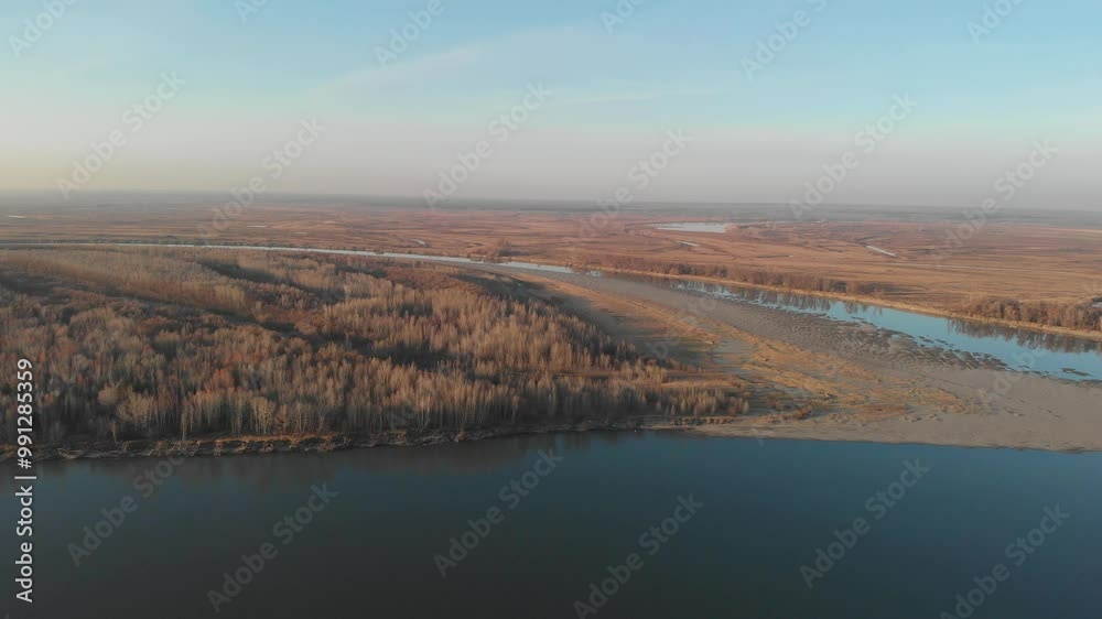 Aerial view of big siberian Ob river, river bank in beauty autumn evening, 4K drone footage. Aerial view of big siberian Ob river, river bank in beauty autumn evening, 4K drone footage.