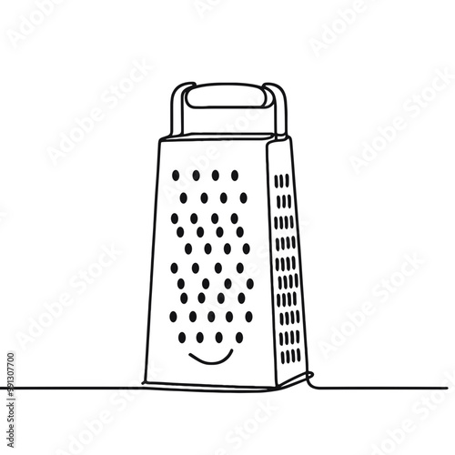 A grater with a smiley face on it. The grater is white and has a black handle