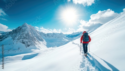 A lone hiker explores a stunning snowy landscape under a bright sun, surrounded by majestic mountains and clear blue skies.