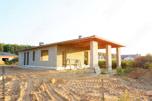 Construction of Modern country house. Suburban house construction. Modern Family house. Cottage home in suburb. Sustainable house in rural. Modern suburb home. Energy-Efficient Home construction. photo