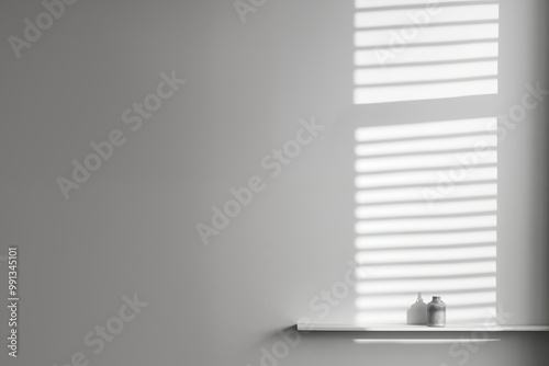  A white wall featuring a window and a shelf, creating a bright and open atmosphere in the room.