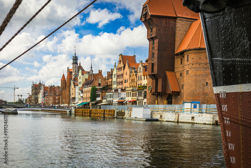 Beautiful city of Gdansk in the margins of the Motlawa river with the touristic boats and coloured buildings