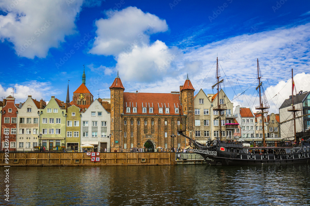 Beautiful city of Gdansk in the margins of the Motlawa river with the touristic boats and coloured buildings Beautiful city of Gdansk in the margins of the Motlawa river with the touristic boats and coloured buildings