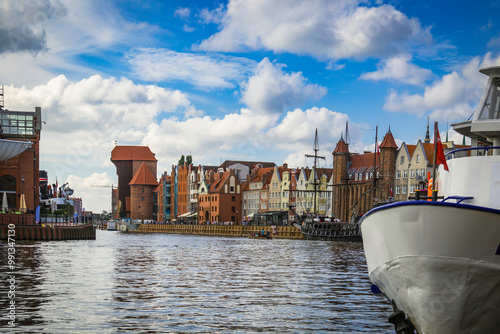 Beautiful city of Gdansk in the margins of the Motlawa river with the touristic boats and coloured buildings