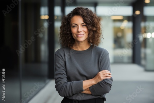 Portrait of a satisfied woman in her 30s dressed in a comfy fleece pullover isolated in sophisticated corporate office background Free Download Portrait of a satisfied woman in her 30s dressed in a comfy fleece pullover isolated in sophisticated corporate office background - GFXLoad