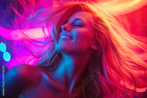 Attractive dancing blonde in the club, neon light, motion effects.