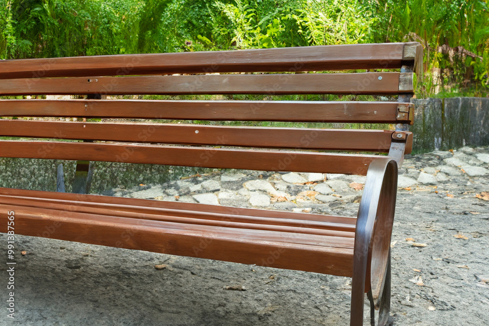 Wooden bench a park summer. landscape outdoor garden concept. wooden bench the green of a park in nature. wooden bench in the green in a park in summer lifestyle.