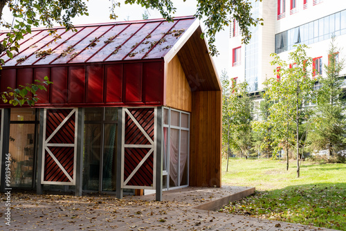 Discover a contemporary, ecofriendly shelter showcasing a unique and innovative design, perfectly nestled within a stunning urban garden environment