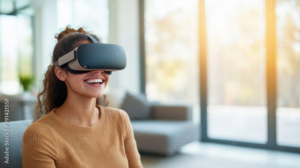 A smiling woman experiencing virtual reality with a headset in a modern, bright living room. A smiling woman experiencing virtual reality with a headset in a modern, bright living room.