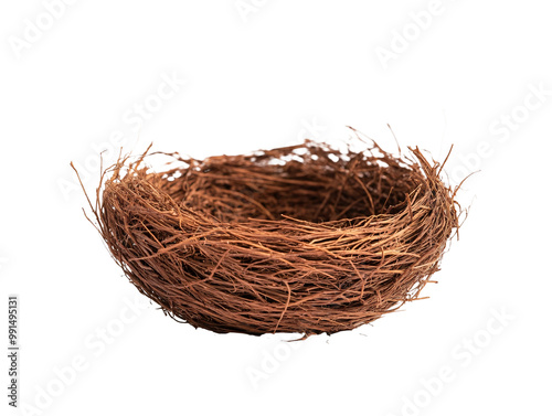 a brown bird nest on a white surface photo