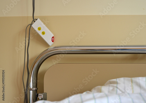 Detail of a hospital bed with emergency call button next to it