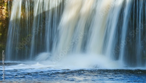 Keila waterfall texture, Estonia. Close-up, long exposure. Blue and white water splashes. Abstract natural pattern. Environmental conservation, travel destinations, graphic resource. Panoramic image