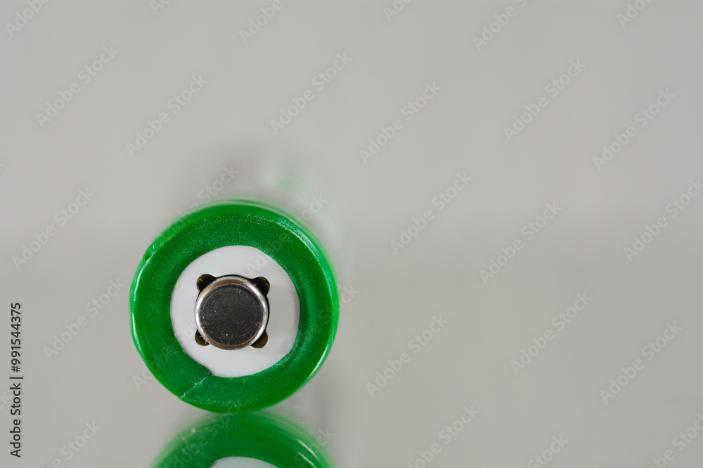 Close up of plus contact of an AA or AAA battery Close up of plus contact of an AA or AAA battery