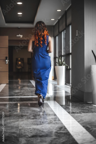 Beautiful girl in an expensive hotel. Girl in a dress.