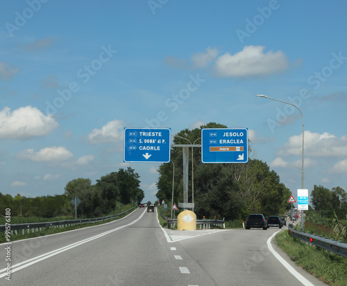 crossroads in Italy with the names of the places to reach CAORLE JESOLO and the text MARE which means SEA in Italian photo