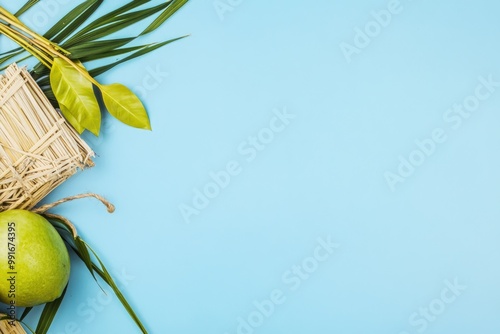 Sukkot Celebration Background with Lulav, Etrog, Hadass, and Aravah on Blue Surface for Festive Designs photo