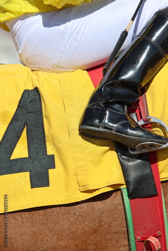 Horse racing jockey number four position