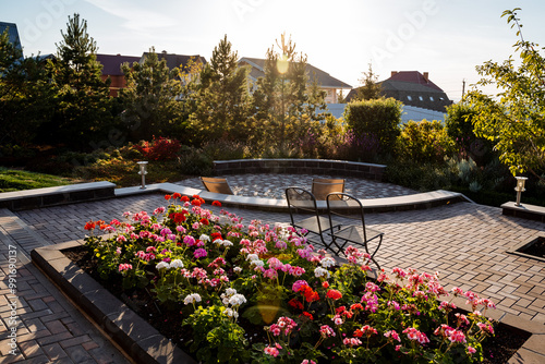 A beautiful garden with colorful flowers and a charming walkway