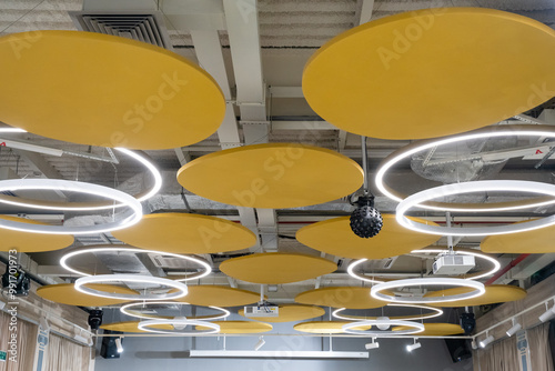 Photos This contemporary ceiling design features elegant circular lights complemented b