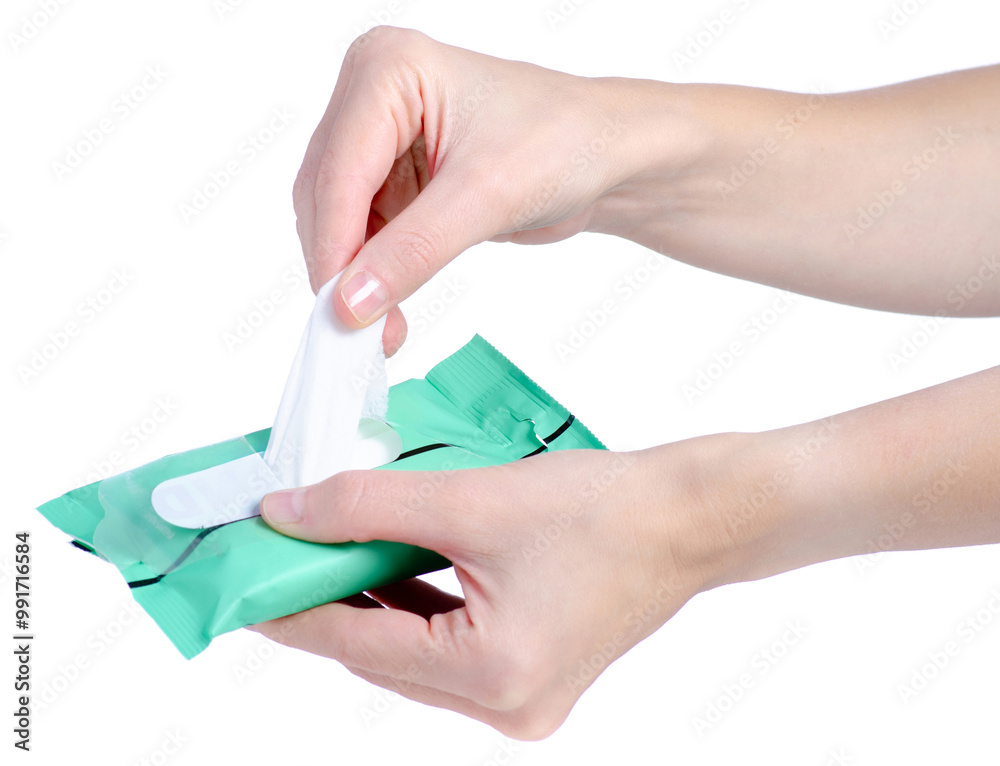Fototapeta premium a pack of wet wipes in female hand on white background isolation