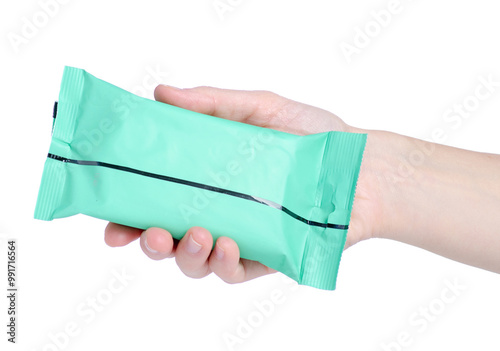 a pack of wet wipes in female hand on white background isolation photo