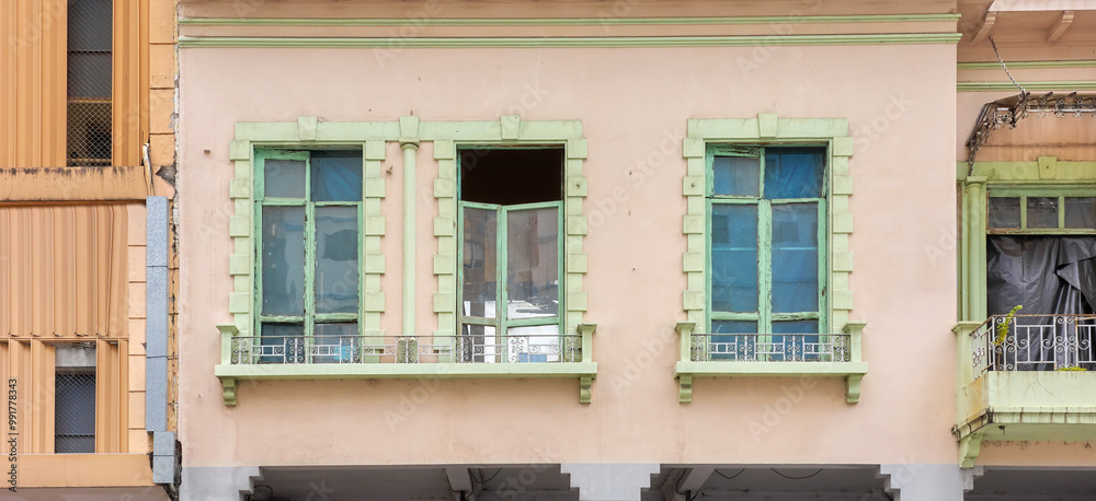 Street view of an old facade of a colonial building in Guayaquil, Ecuador. Street view of an old facade of a colonial building in Guayaquil, Ecuador.