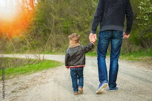 A beautiful hands of parent and child outdoors in the park