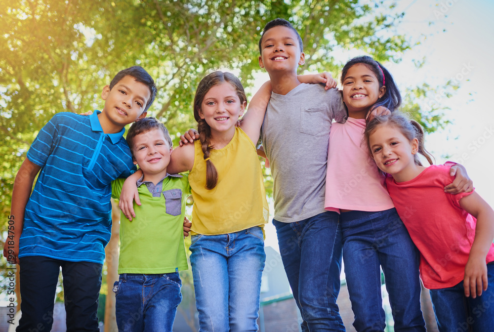 Fototapeta premium Happy, hug and portrait of children in park for playing, bonding and fun together outdoors. Youth, diversity and young boys and girl in nature for childhood, adventure and friendship on playground