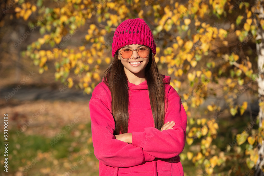 trendy and stylish teenager girl smiling. fall fashion style for teen. outfit for the fall style. autumn outdoor. girl in autumn style. teen girl wear sunglasses. autumn fashion girl. Sweater season trendy and stylish teenager girl smiling. fall fashion style for teen. outfit for the fall style. autumn outdoor. girl in autumn style. teen girl wear sunglasses. autumn fashion girl. Sweater season