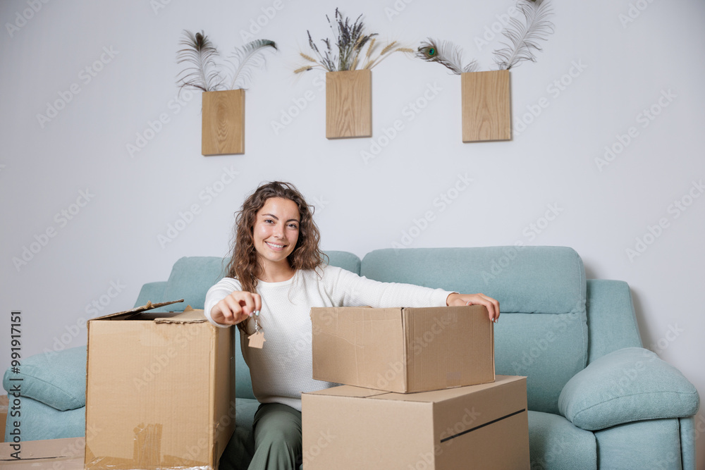 Very happy young woman holding the keys to her new house in her hands. A dream come true, to be a homeowner. Mortgage concept. Pure happiness. Very happy young woman holding the keys to her new house in her hands. A dream come true, to be a homeowner. Mortgage concept. Pure happiness.