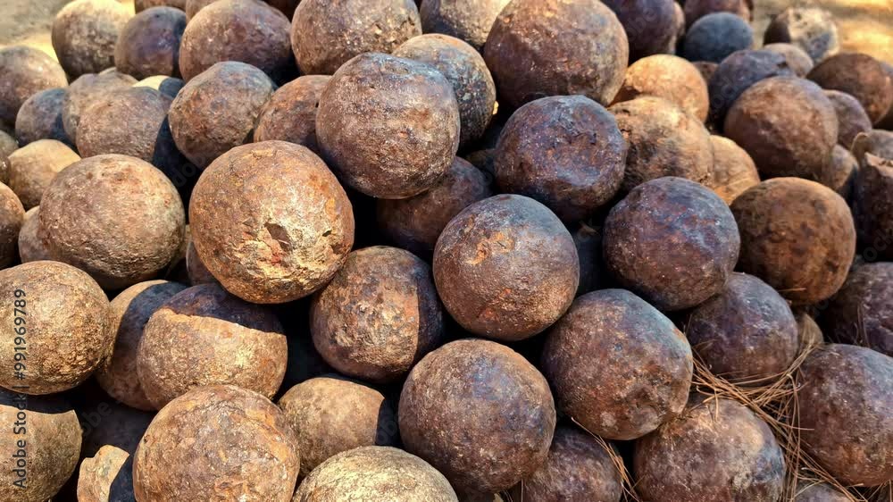 Cannonballs in a pile - pullback reveal of a pile of historic round shot in a Venetian castle Cannonballs in a pile - pullback reveal of a pile of historic round shot in a Venetian castle