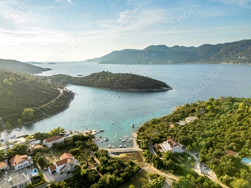 Korcula Island, Croatia - August 5, 2024: Aerial panorama of the small village of Zrnovo in the island of Korcula opposite the peninsula of Peljesac in the region of Dalmatia, Croatia