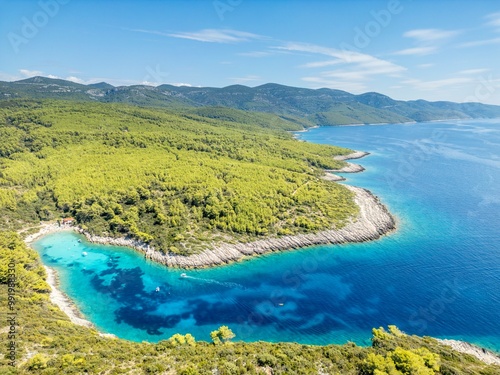 Fototapeta Naklejka Na Ścianę i Meble -  Korcula Island, Croatia - August 5, 2024: An overhead view of Zitna Beach, on a wonderfully spectacular bay on Korcula Island in Croatia. The water is a beautiful turquoise colour.