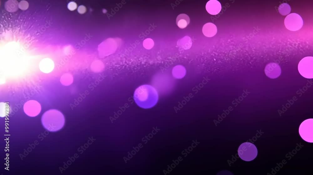A bright light shines through purple and pink bokeh circles on a dark background