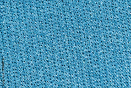 Texture of blue jacquard fabric of diagonal rough weave cloth structure macro background