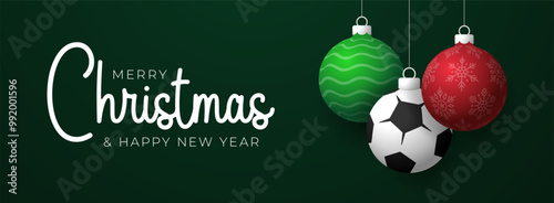 soccer Christmas Greeting card. Merry Christmas and happy new year sport greeting card. Hang on a thread green and red xmas ball bauble