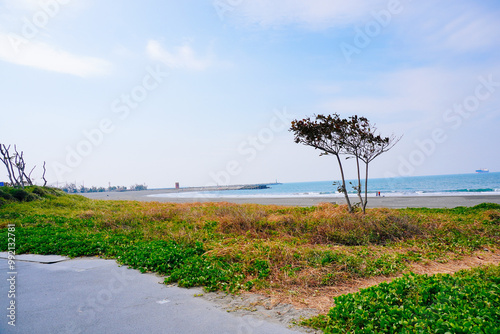 Kaohsiung, Taiwan, Republic of China, 01 25 2024: The landscape of Kaosiung Sizihwan Bay beach in Kaohsiung  photo