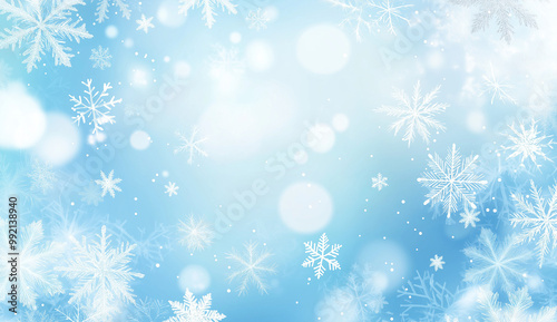 Light blue winter background with floating snowflakes and soft bokeh
