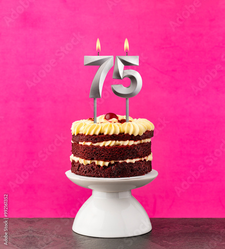 Red velvet cake - Birthday number 75 on a pink background. photo