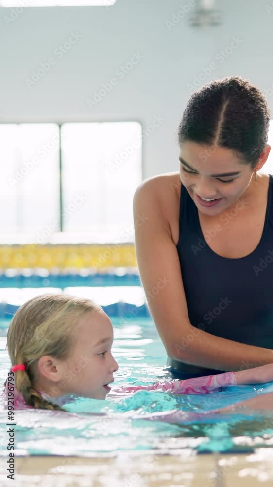Teacher, woman and girl in swimming pool for learning with smile, support and helping hand to float. Person, coach and child in water with practice for balance, stroke and development with safety Teacher, woman and girl in swimming pool for learning with smile, support and helping hand to float. Person, coach and child in water with practice for balance, stroke and development with safety