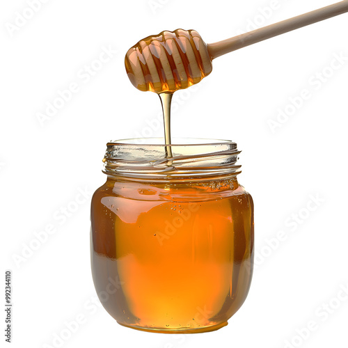 A jar of honey is poured out of a spoon photo