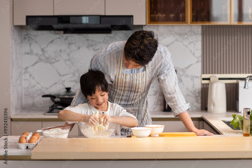 Father And Son Cooking In The Kitchen Father And Son Cooking In The Kitchen