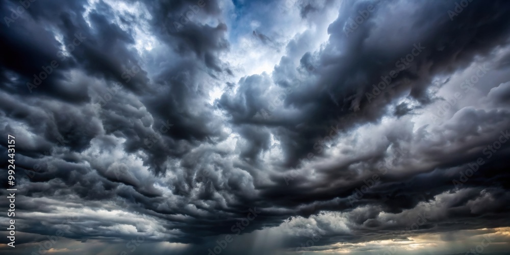 Obraz premium Dark stormy sky filled with ominous gray clouds, stormy, overcast, gloomy, ominous, dark, cloudy, weather, nature, atmospheric