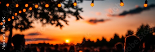 a vibrant Oktoberfest beer garden at sunset full of people laughing drinking beer and enjoying live folk music with string lights hanging from trees creating a cozy and inviting atmosphere photo