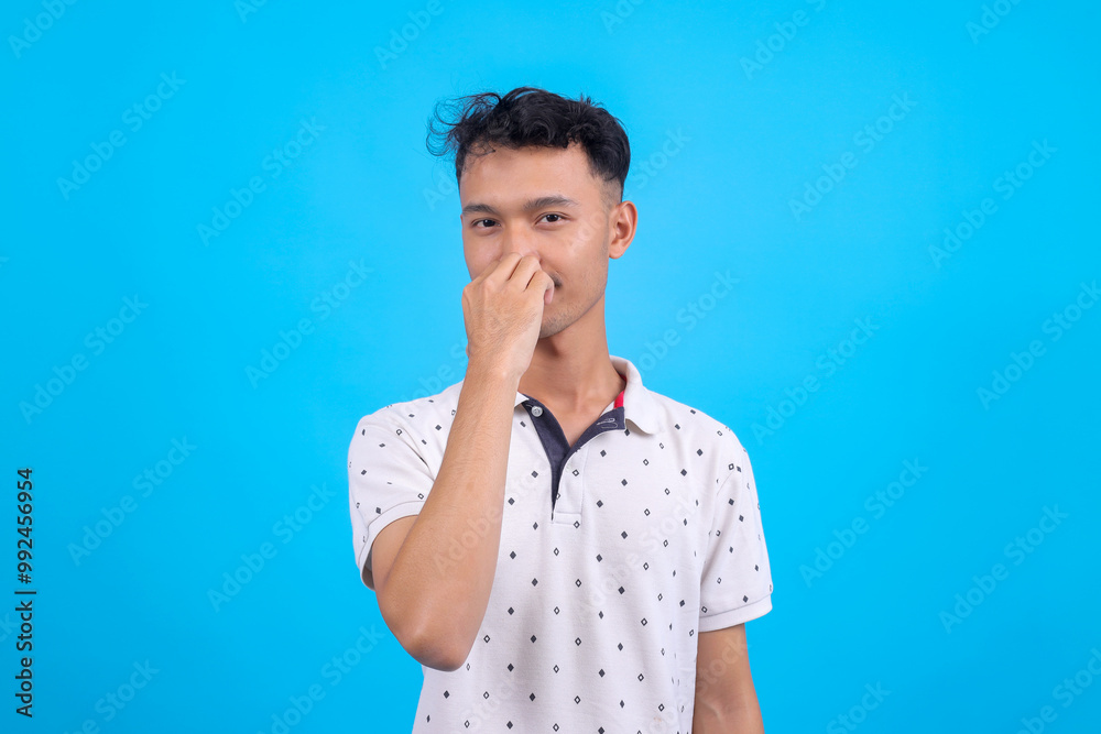 Asian Man Has a Communication Disorder Showing Sign Language Isolated on Blue Background
Asian Man Has a Communication Disorder Showing Sign Language Isolated on Blue Background