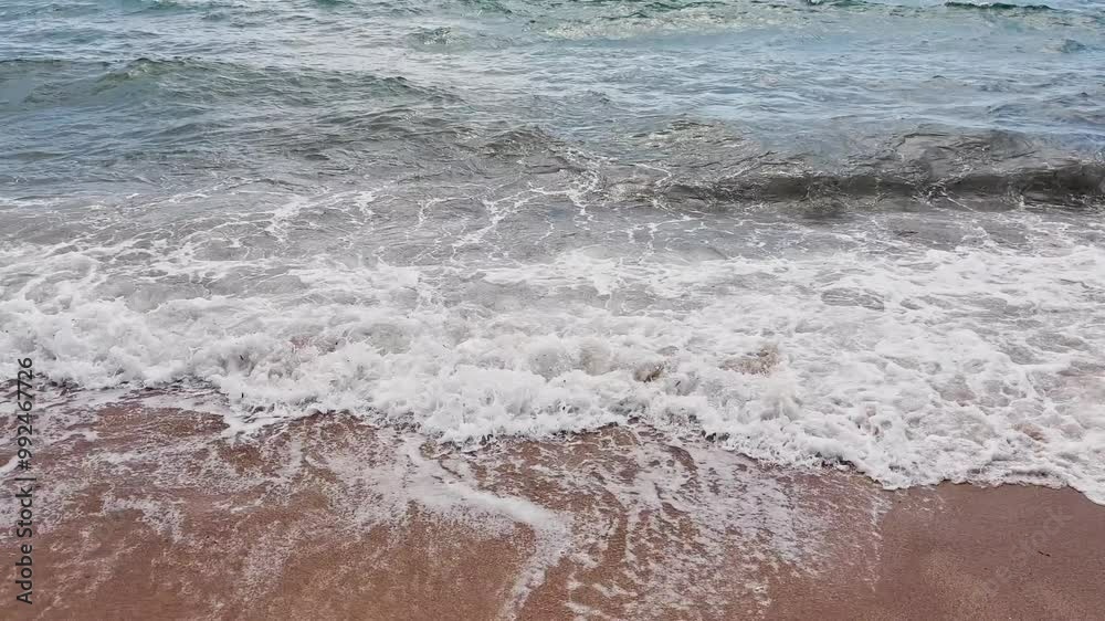 Cinematic sea and ocean waves glide across the sand