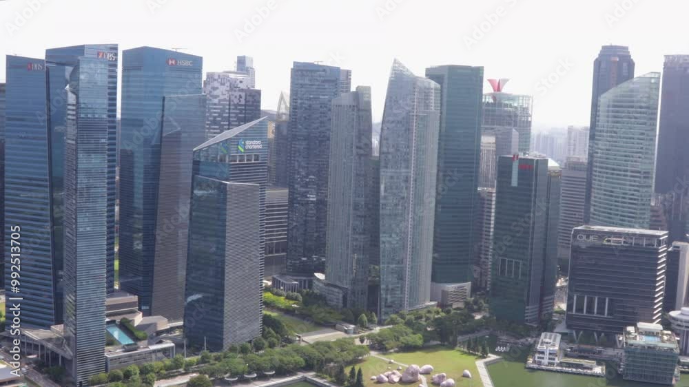 Modern skyscrapers in Singapore city skyline on a sunny day, aerial view Modern skyscrapers in Singapore city skyline on a sunny day, aerial view