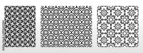 Geometric floral set of seamless patterns. White and black vector backgrounds. Damask graphic ornaments.