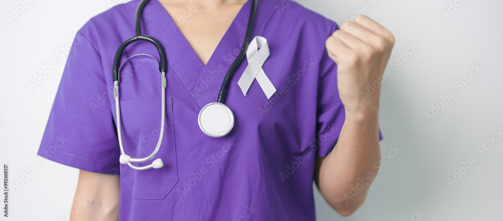 Stop Violence Against Women and November Lung Cancer Awareness month. Doctor with White ribbon in hospital. Healthcare and World Cancer day concept Stop Violence Against Women and November Lung Cancer Awareness month. Doctor with White ribbon in hospital. Healthcare and World Cancer day concept