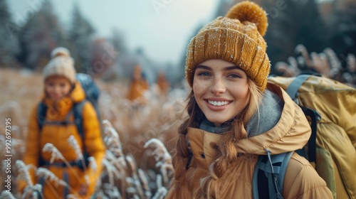 young happy friends hiking and enjoying nature, exploring the great outdoors, embracing an active lifestyle at sunny day.